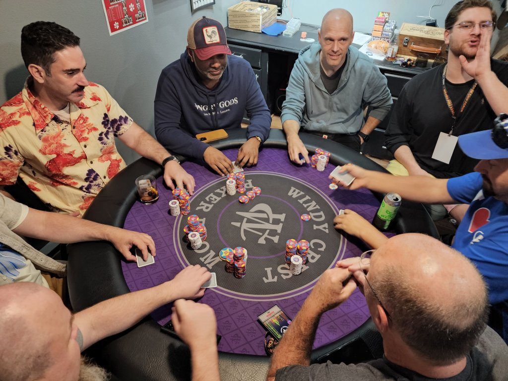 People gathering around poker table