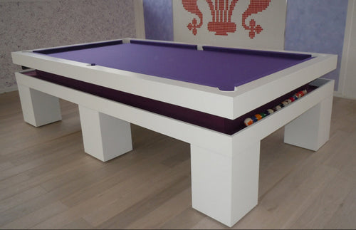 Luxury White Pool table with purple felt and pool balls on a wooden floor.