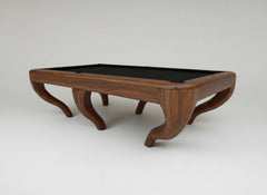 luxury walnut pool table with a black felt surface on a white background